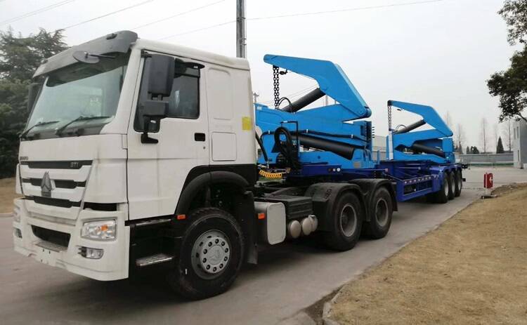Self unloading container lift trailer with truck head